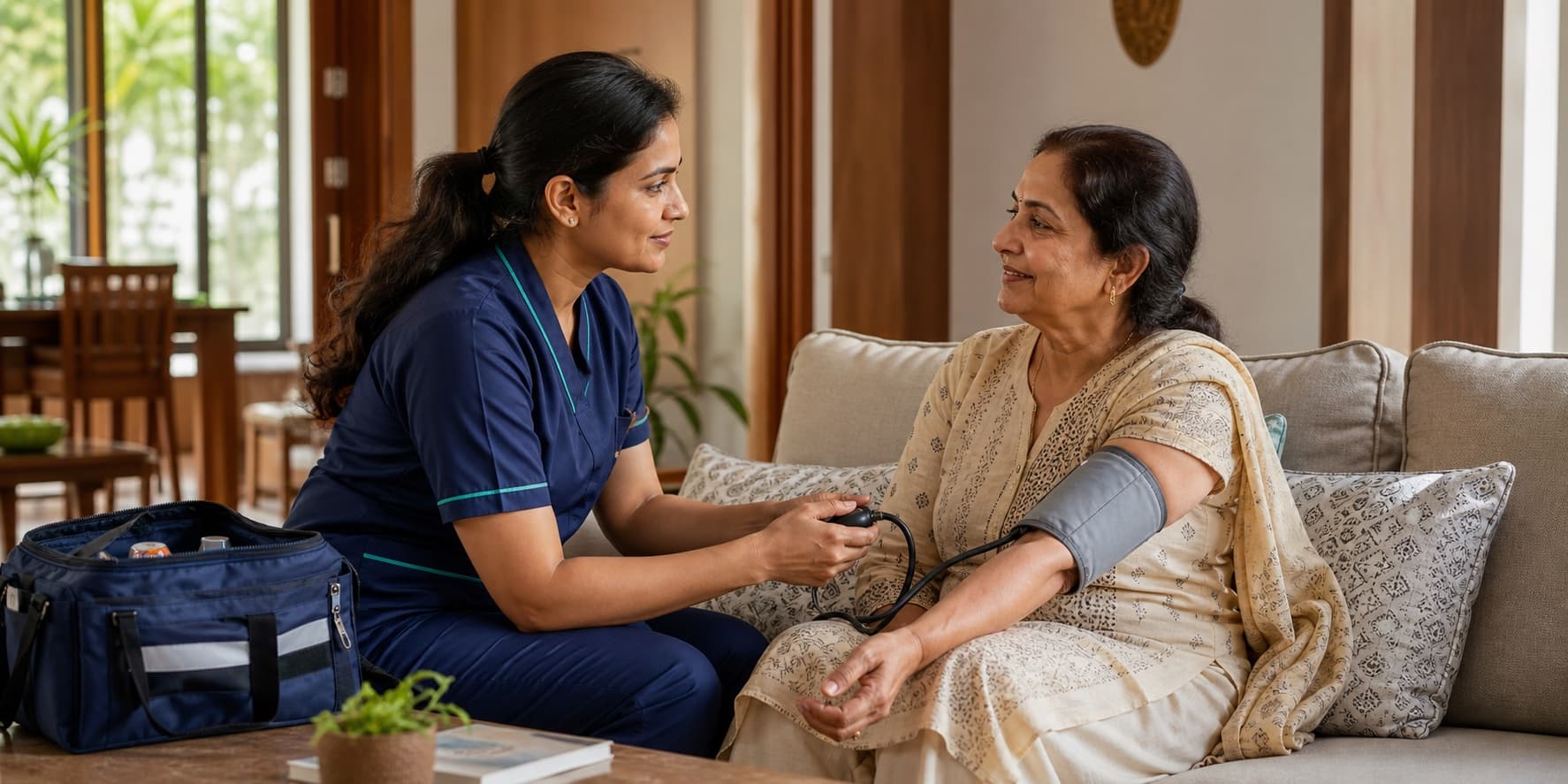 A registered home nurse checking an older woman's blood pressure at home